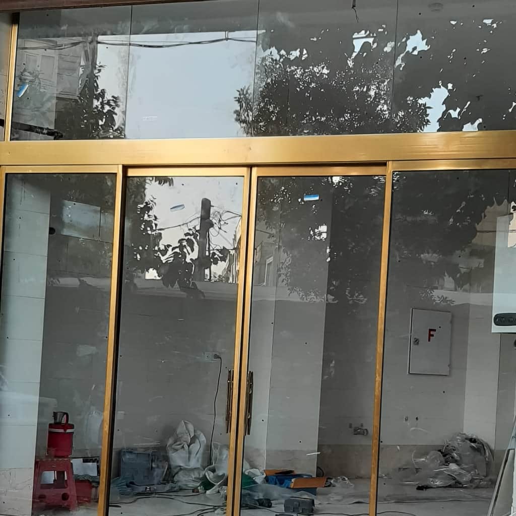 تولید درب اتوماتیک شیشه ای دو لنگه کشویی طبق ابعاد دهانه