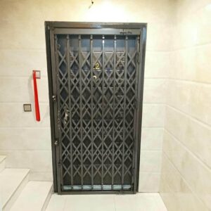 درب آکاردئونی آپارتمان فلزی با طراحی کشویی ورودی ساختمان