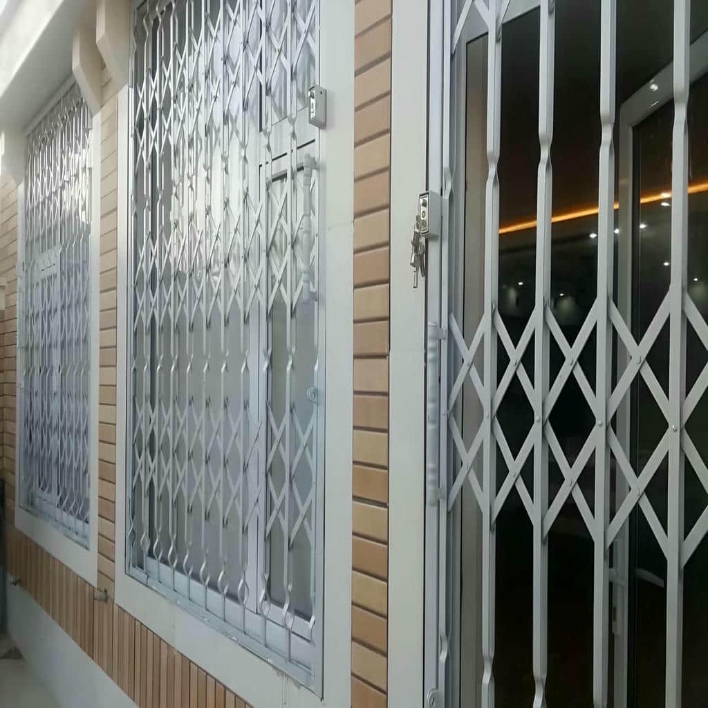 حفاظ آکاردئونی ساختمان مسکونی با پوشش رنگ مقاوم