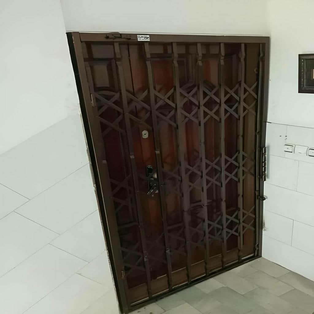حفاظ درب آکاردئونی طوسی پروژه مسکونی بیرجند